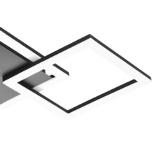 Detailopname van een moderne, vierkante LED-plafondlamp met in elkaar grijpende frames.