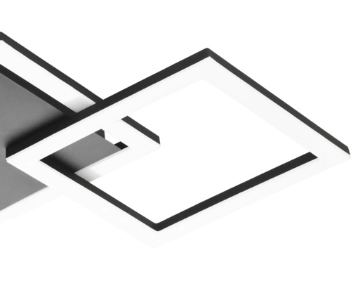 Detailopname van een moderne, vierkante LED-plafondlamp met in elkaar grijpende frames.