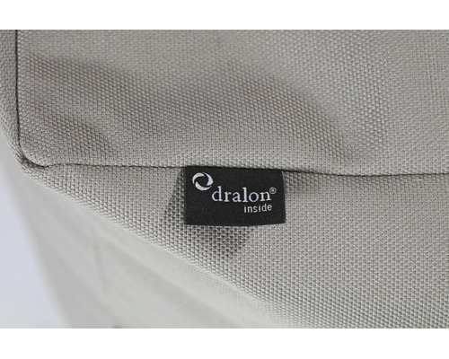 Detailopname van een textielweefsel met een Dralon Logo label.