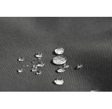 Detailopname van een waterafstotende stof met waterdruppels op het oppervlak.