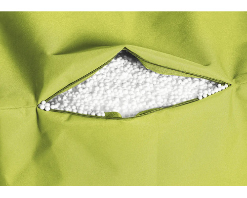 Zitzakvulling van witte polystyreenparels zichtbaar door een geopende ritssluiting in de groene stoffen hoes.