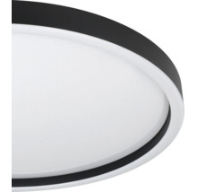 Ronde LED-plafondlamp met sterrenhemel-effect en zwarte rand.