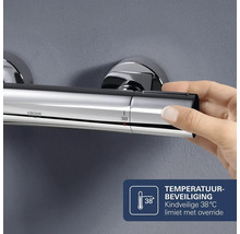Grohe thermostatische douchekraan met kindveilige 38 graden Celsius temperatuurbegrenzing en override functie.