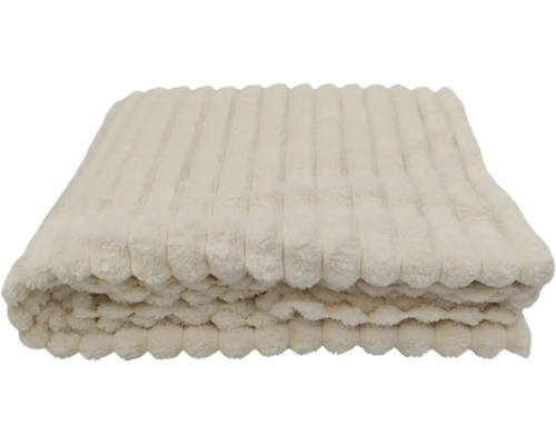 Een opgevouwen plaid van zachte pluche met een geribbelde structuur.