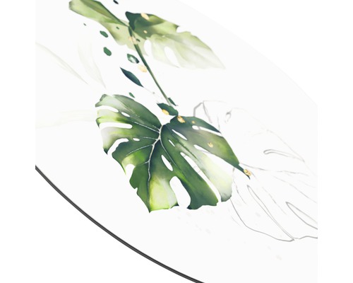 Close-up van een tafel met een Monstera-bladmotief