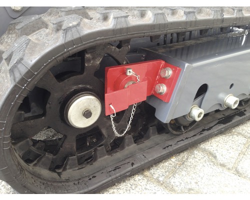 Detailweergave van een rupsband aan een bouwmachine