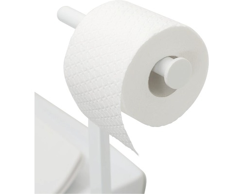 Toiletpapier op houder naast toilet