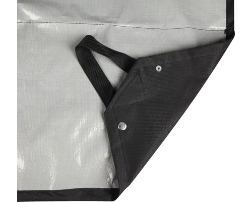 Detailopname van een afdekzeil met ogen en draaglus