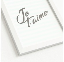 Ingelijste foto met de tekst 'Je t'aime'.