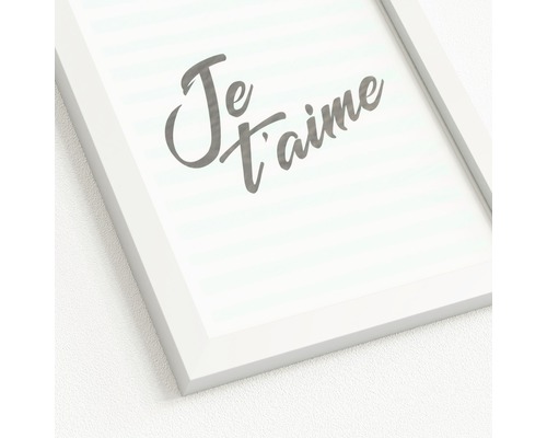 Ingelijste foto met de tekst 'Je t'aime'.