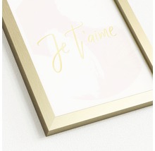 Decoratieve afbeelding met gouden lijst en de tekst 'Je t'aime'
