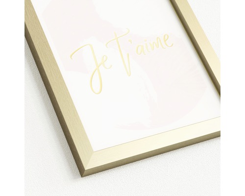 Decoratieve afbeelding met gouden lijst en de tekst 'Je t'aime'