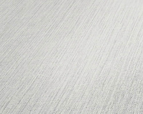 Close-up van een wit textielbehang met een fijne structuur