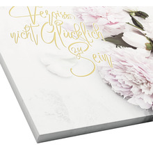 Canvas schilderij met bloemmotief en de spreuk Mis het niet om gelukkig te zijn
