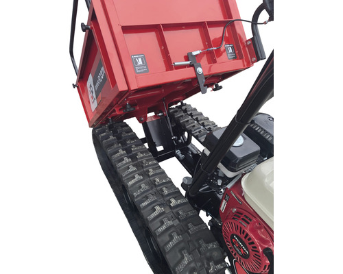 Detail van een gemotoriseerde kruiwagen met rupsbanden en een omhoog gekantelde laadbak