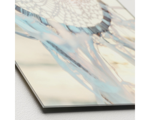 Close-up van een bedrukt canvas met een dromenvanger-motief