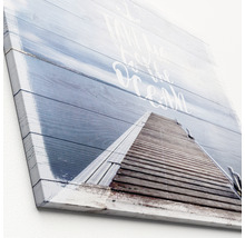 Canvas schilderij met motief van een steiger naar de oceaan