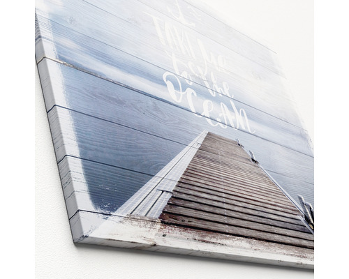 Canvas schilderij met motief van een steiger naar de oceaan