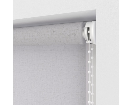 Detail van een rolgordijn met bedieningsketting