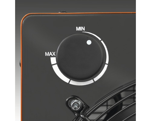 Close-up van een elektrische kachel met een draaiknop om de temperatuur in te stellen van minimaal tot maximaal