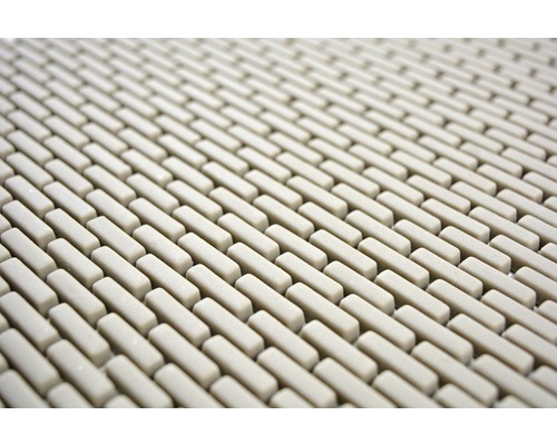 Detail van een douchemat met rechthoekige elementen.