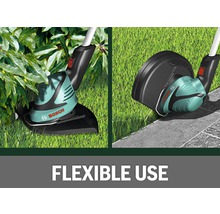 Bosch grastrimmer in gebruik aan de rand van het gazon en onder struiken