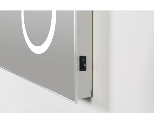 Detail van een spiegelkast met schakelaar