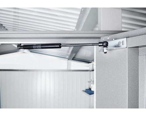 Detailopname van een gasdrukdemper op een metalen constructie