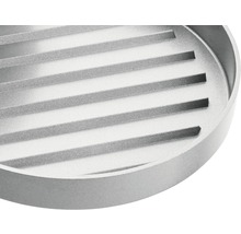 Rond metalen grillrooster met geribbeld oppervlak