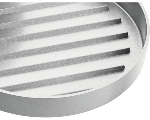Rond metalen grillrooster met geribbeld oppervlak