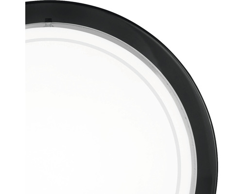 Gedetailleerde weergave van een ronde lamp met een donker frame