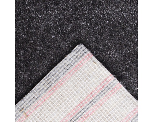 Detailweergave van een grijze tapijttegel met textielrug