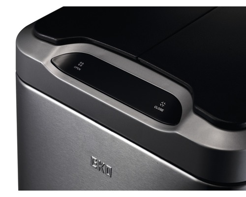 Detailweergave van een afvalbak met sensorknoppen voor openen en sluiten