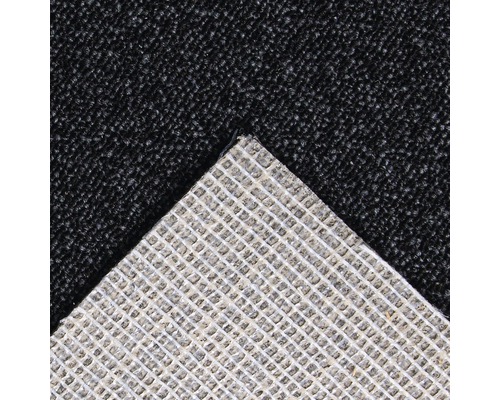 Detailweergave van een tapijt met textielrug