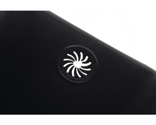 Detailopname van een ventilatiegat in een zwart kunststof product