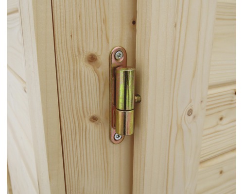 Close-up van een scharnier op een houten deur