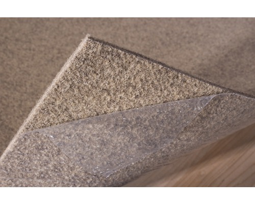 Antislip tapijt met zelfklevende folie voor bevestiging op de ondergrond.