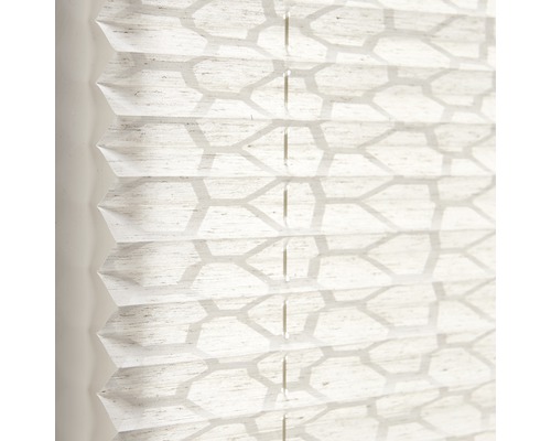 Close-up van een plisségordijn met geometrisch motief