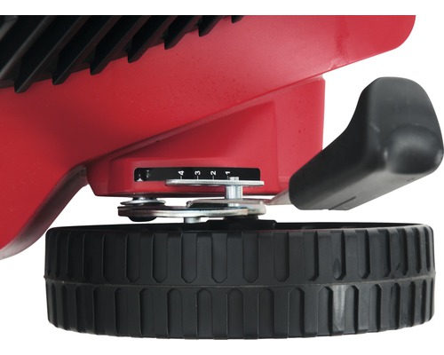 Detailaanzicht van een gazonbemester met doseerhendel en instelschaal