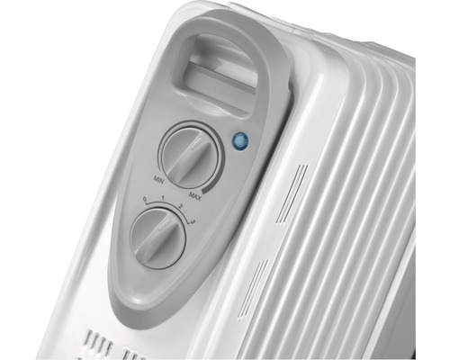 Detailopname van een olieradiator met temperatuurregelaars