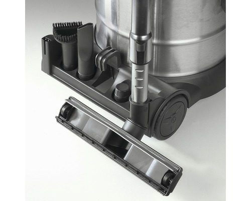 Detail van een stofzuiger met hulpstukken en borstels.