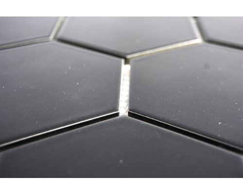 Close-up van zeshoekige tegels met voegen