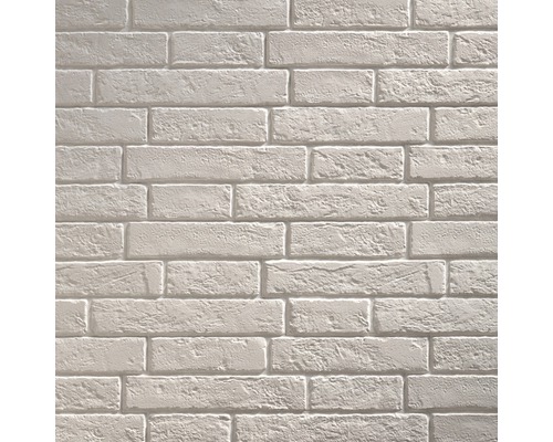 Lichte bakstenen muur als achtergrond voor bouwprojecten