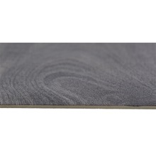 Close-up van een grijze vinyl vloertegel met houtlook