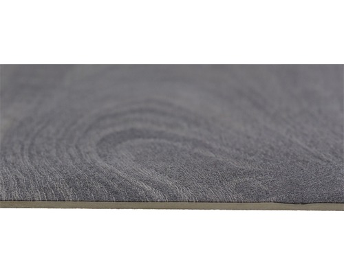 Close-up van een grijze vinyl vloertegel met houtlook