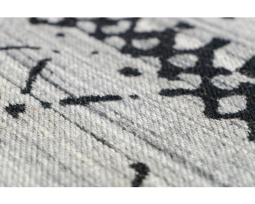 Detailopname van een tapijt met patroon