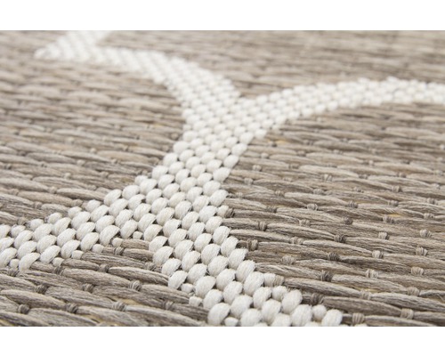 Detailopname van een tapijt met geweven textuur en patroon