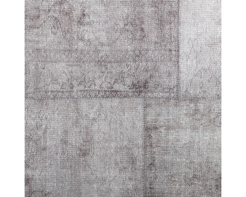 Detailweergave van een tapijt met patchworkpatroon