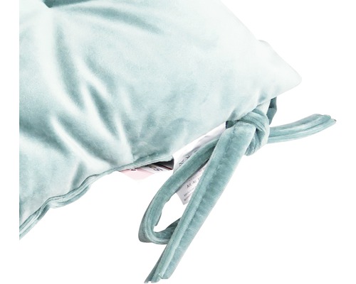 Detail van een kussen met strikbanden