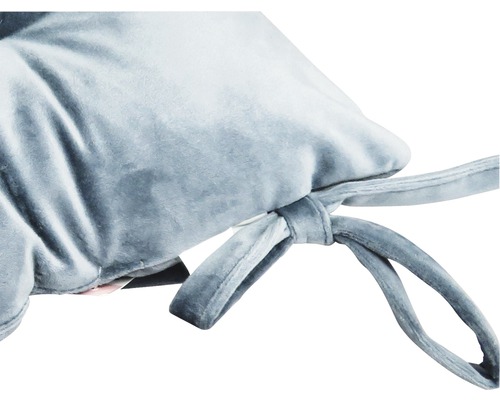 Close-up van een zitkussen met strikbanden voor bevestiging